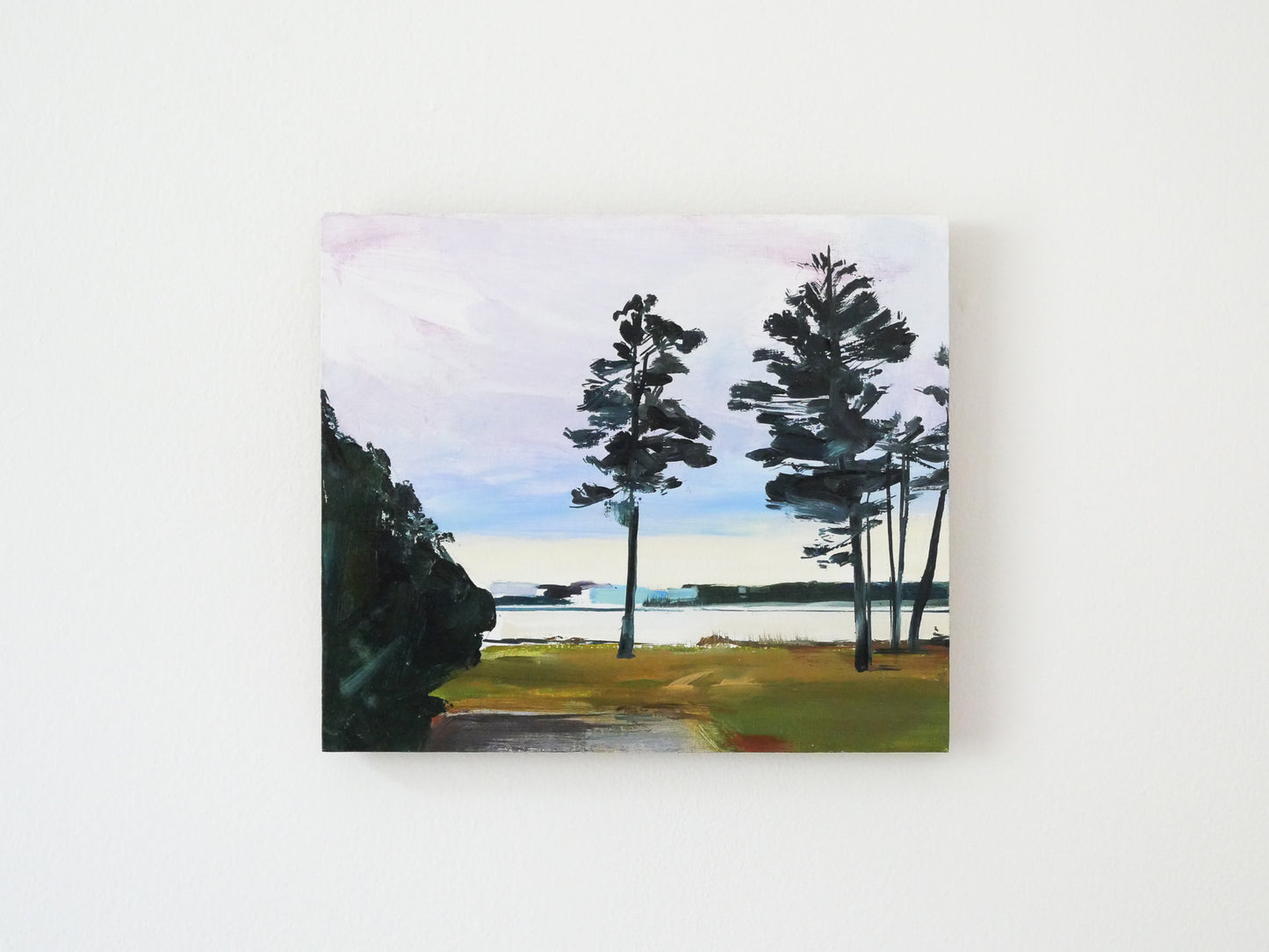 Oil landscape painting featuring tall pines by a river. The trees are in shadow against the bright evening sky.
