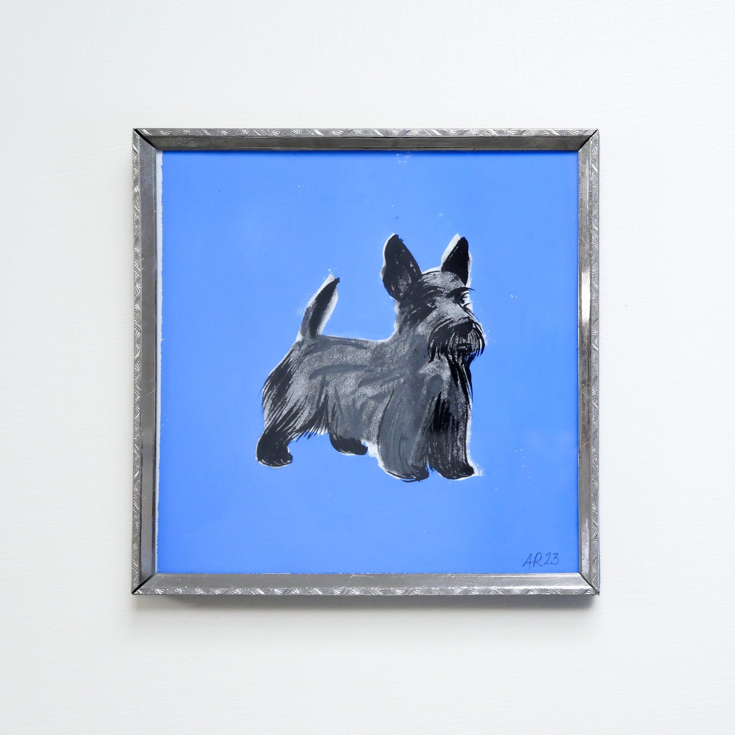 Playful monotype with gouache of Scottish terrier against bold cobalt blue background in silver metal recycled frame
