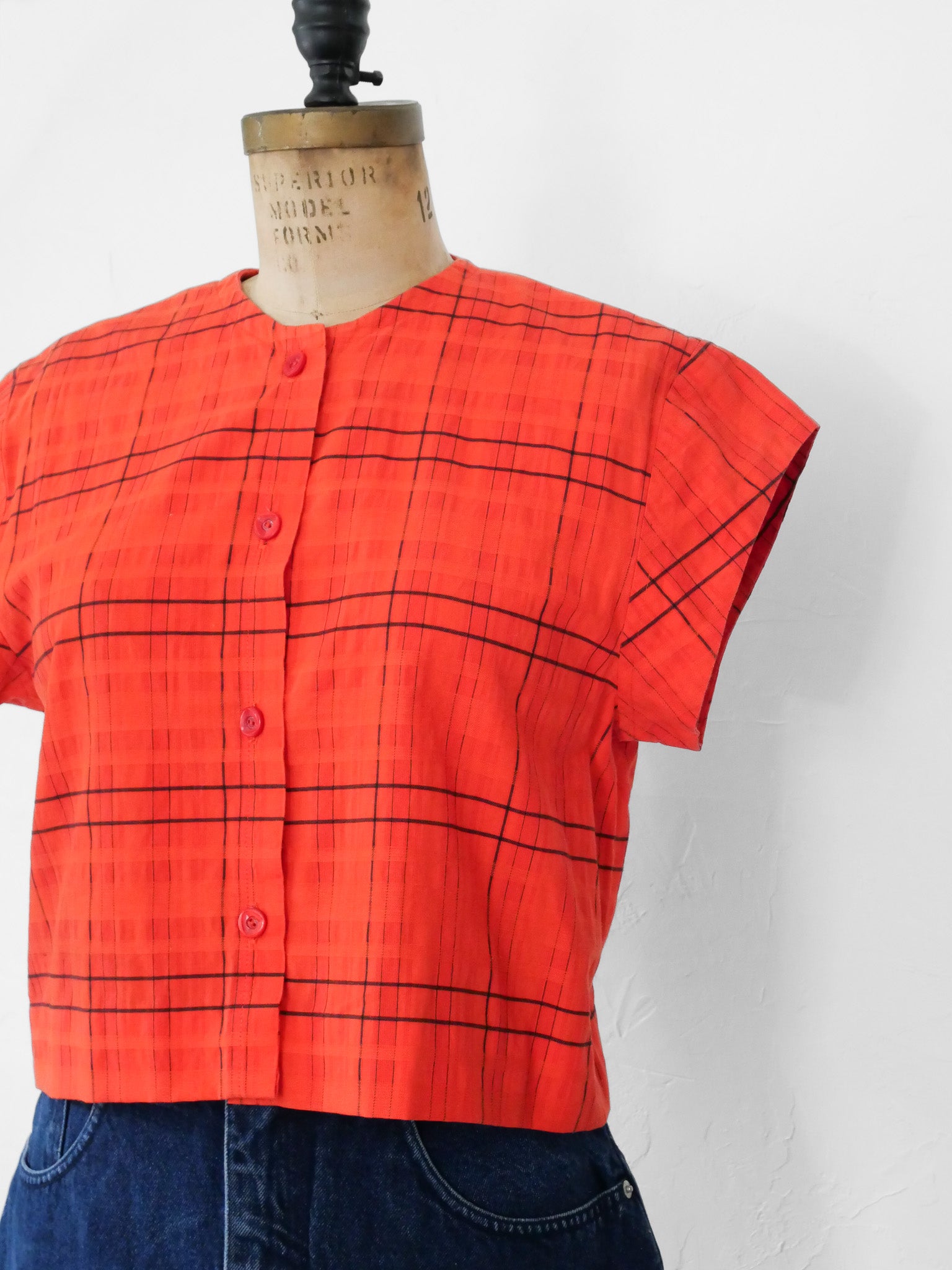Red orange upcycled crop top on dress form